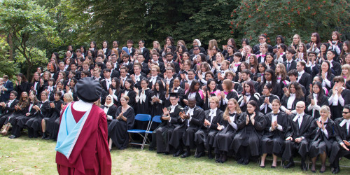 Graduands on College House lawn